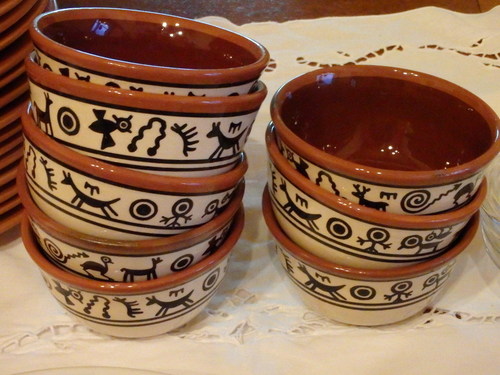 Argentine dishware and indigenous symbols.